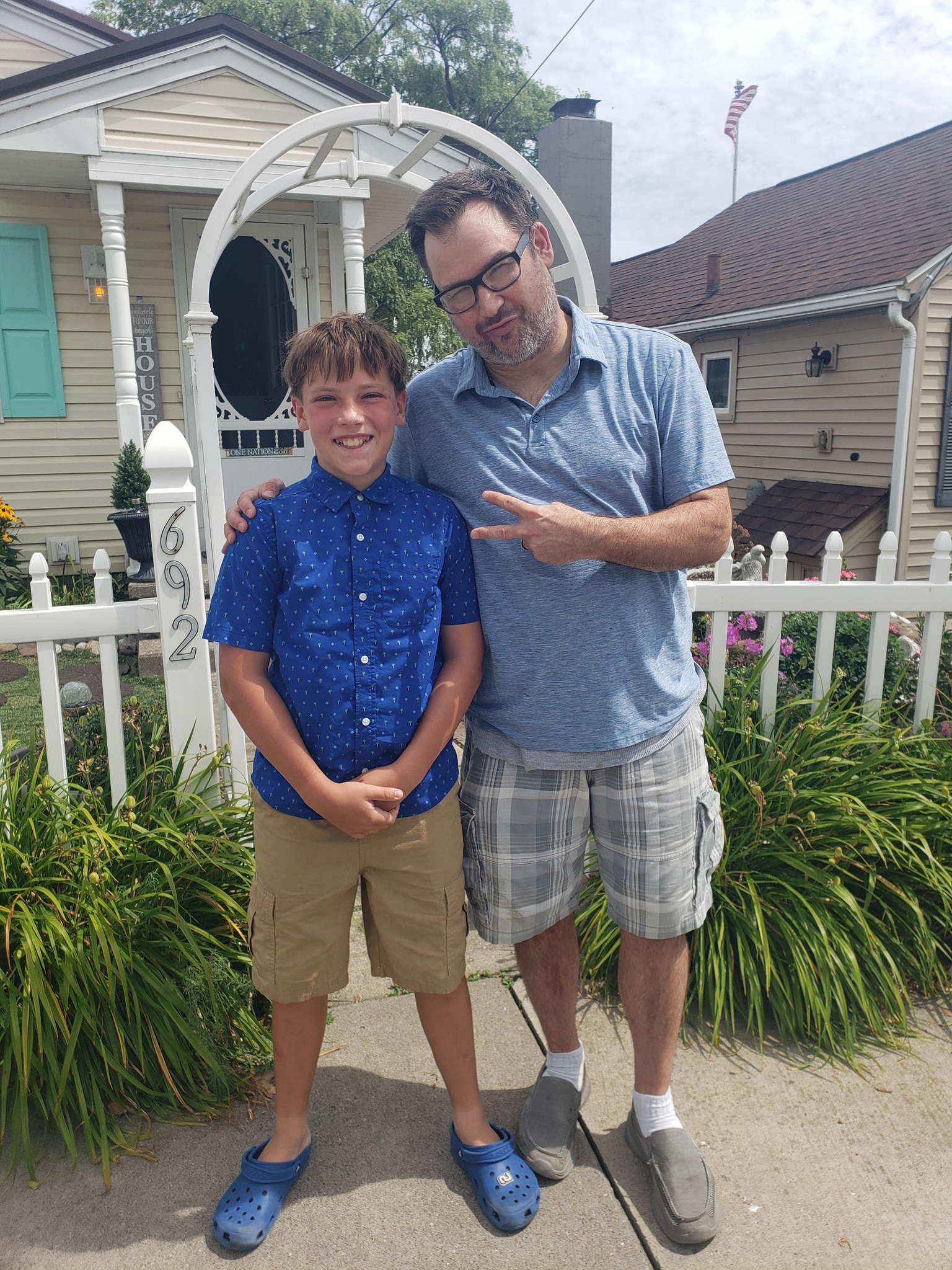 Mr Joe with Isaac, one of his piano students, outside a Rochester home studio
