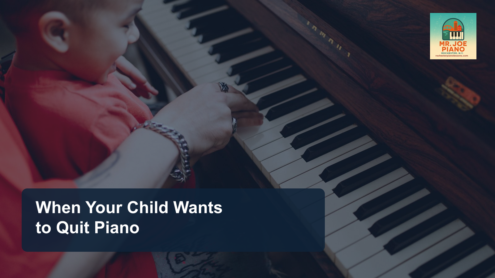 Parent and child sitting together at a piano during a quiet music lesson.